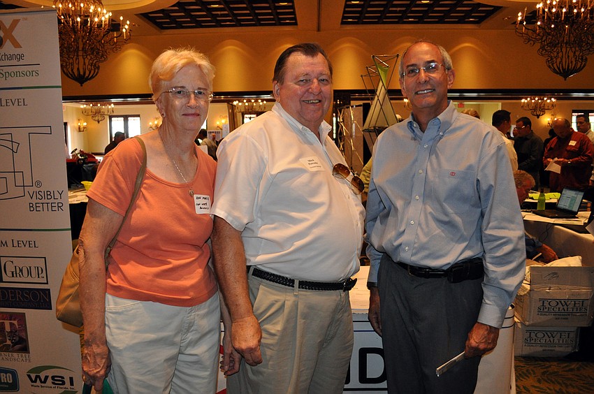 Ann Marie and Mitch Pietruszka of Sun State Awnings and Jerrold Schoenholtz, vice president of Tandem Construction