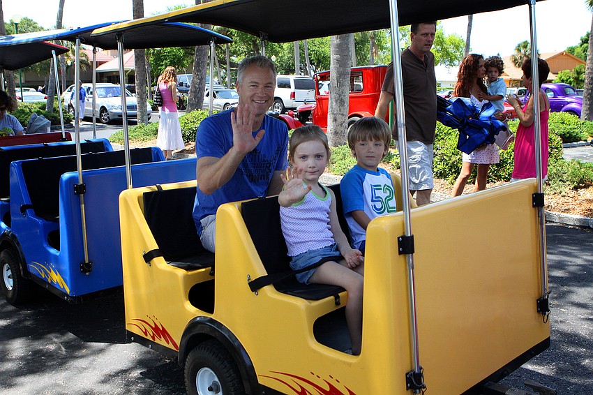 Keith Hagan along with his daughter Lianna Hagan and LT Hamilton get ready to go on a ride on the Royal Express on Sunday, April 17 during South Bay's Family Fun Day.