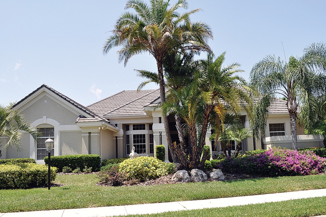 This home in the Country Club of Lakewood Ranch features four bedrooms, four baths, a pool and 4,271 square feet of living area.