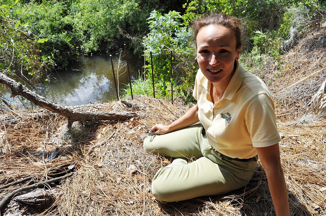 Summerfield Bluffs resident Tammy Kovar is worried about the erosion behind her home. She and other residents are trying to determine what can be done to correct the problem.