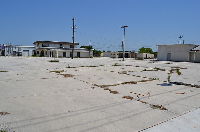 The former Owen Motors property, at 2134 N. Washington Blvd., sits empty after a foreclosure. Now the city wants to purchase the almost two-acre site and add it to the undeveloped Marion Anderson brownfield.