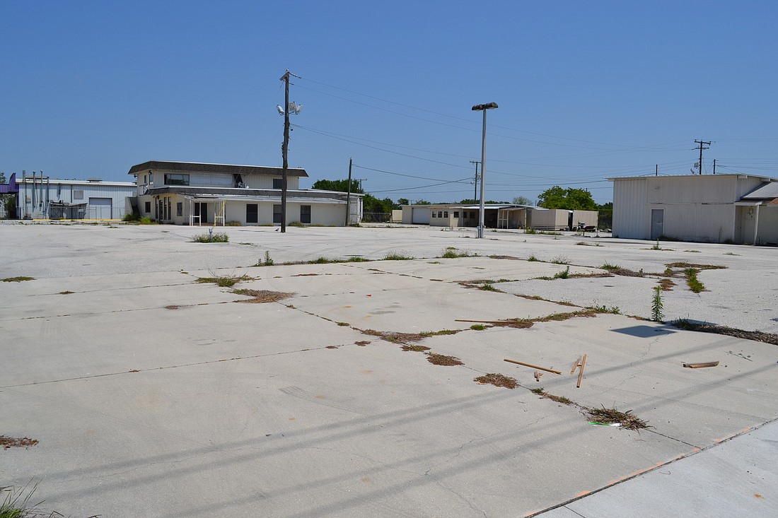 The former Owen Motors property, at 2134 N. Washington Blvd., sits empty after a foreclosure. Now the city wants to purchase the almost two-acre site and add it to the undeveloped Marion Anderson brownfield.