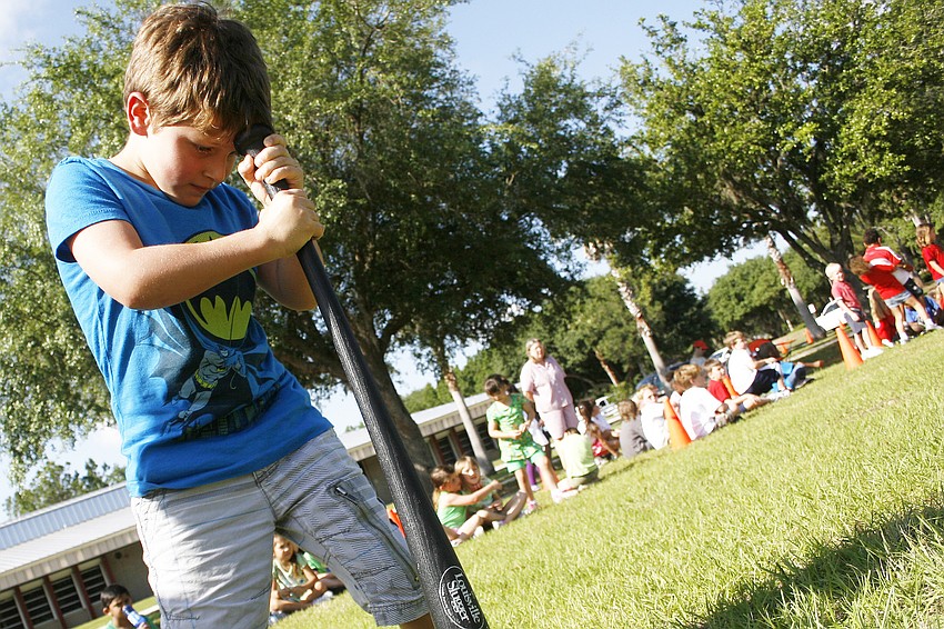Daylin Sciarrone didn't mind getting a little dizzy during this baseball bat relay.