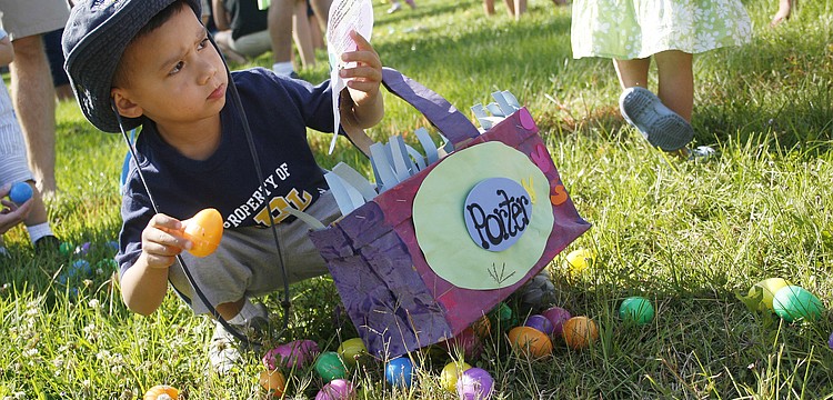 Porter Strand, 4, selected his eggs carefully according to the hunt instructions.