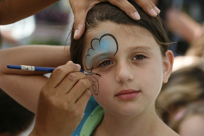 Abby Burch, 7, got her face painted before the Easter egg hunts began.