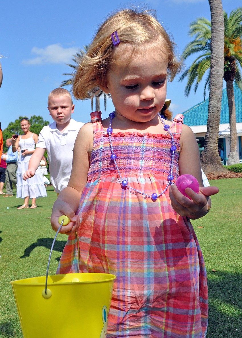 Three-year-old Caitlin Neal found a pink egg to match her dress.