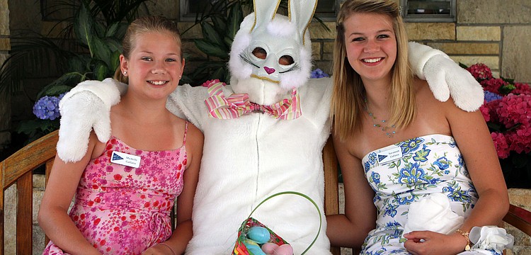 Michelle and Savannah Gallatin pose with the Easter Bunny Sunday, April 24 at Bird Key Yacht Club.