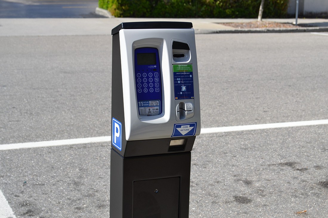 The parking pay station will accept both coins and credit/debit cards.