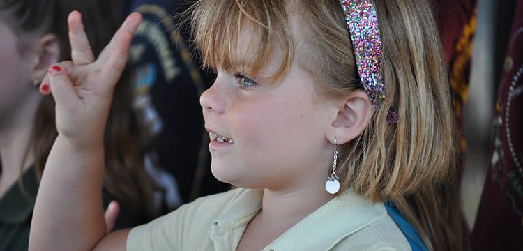 Molly Cress counts to five in Spanish during the performance.