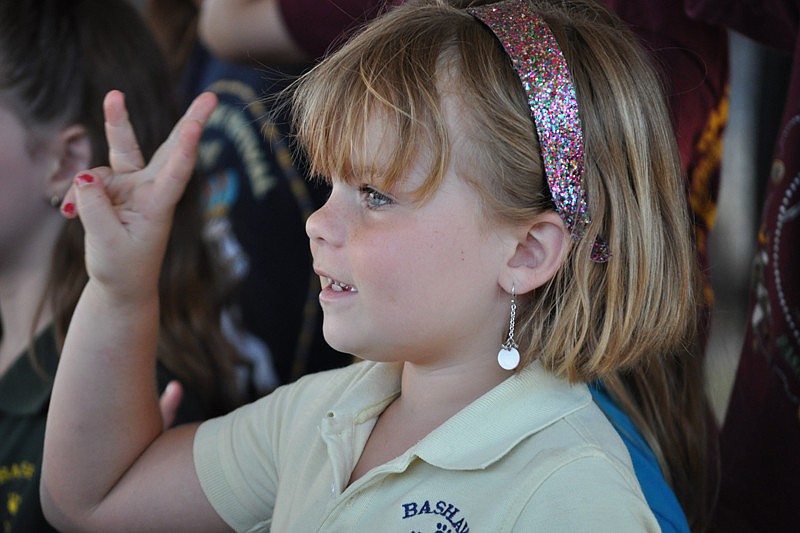 Molly Cress counts to five in Spanish during the performance.