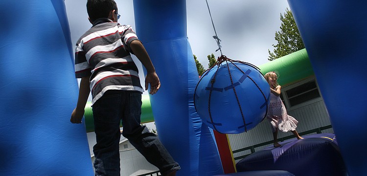 The FCAT Fun Day featured a variety of inflatable bounce houses and obstacle courses.