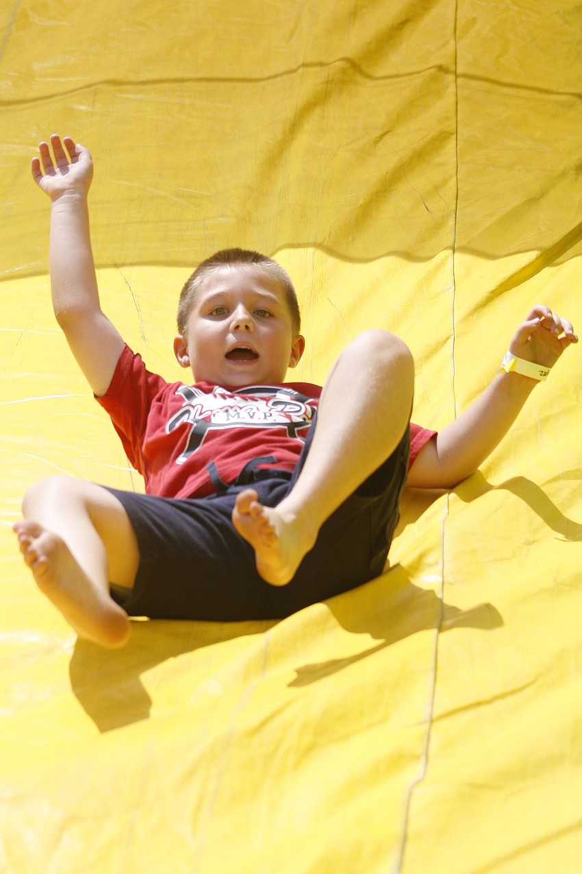 Mason Kaufman zoomed down this huge yellow slide.