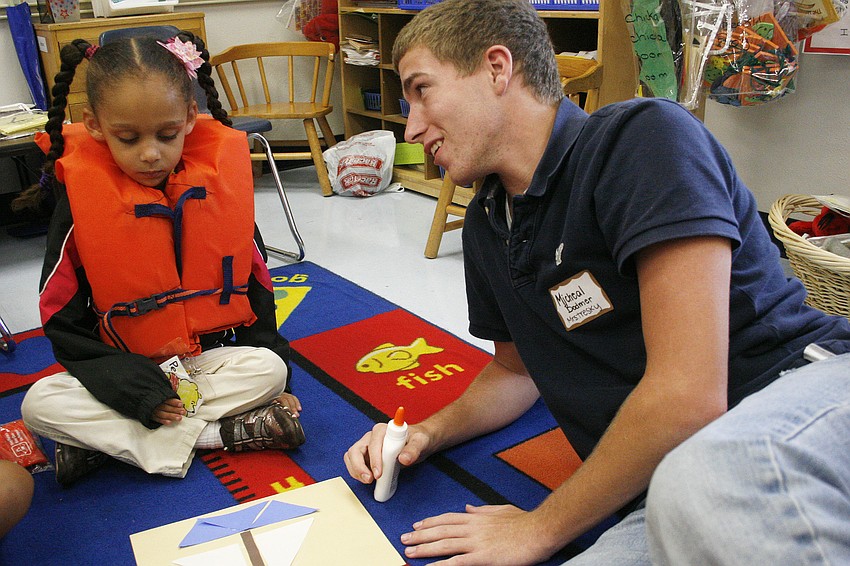 Lakewood's Micheal Bodmer, right, was a natural working with the elementary kids.