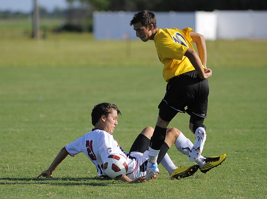 Florida Soccer Alliance's John Neidert loses control of the ball to Florida Fusion's Frankie Pinciotti.