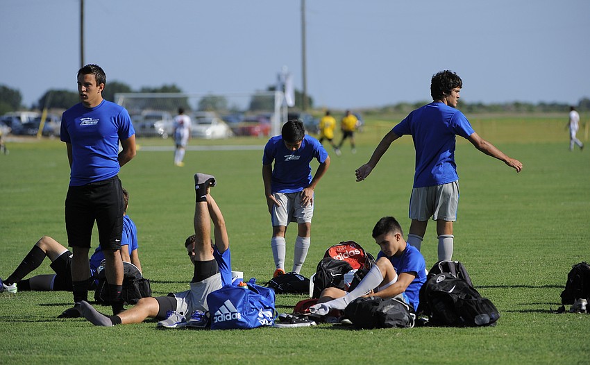 Members of the Florida Rush U17 team out of Orlando warm up before the start of their game May 1.