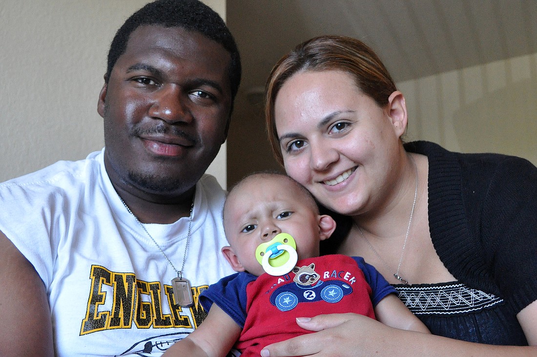 Anthony and Ivette Littlejohn with their son, Adrian