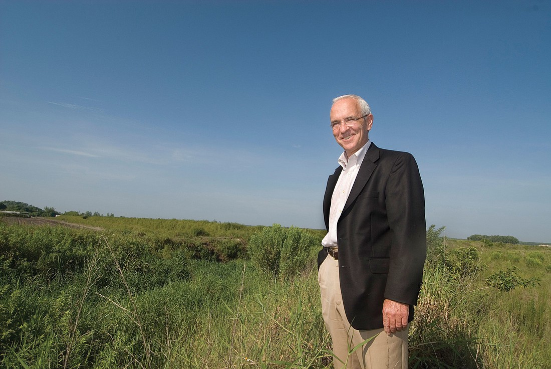 Charles Hewett, executive vice president and chief operating officer of The Jackson Laboratory, stands at the proposed site of research lab in eastern Collier County last summer before the institute abandoned the project at the end of 2010.