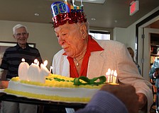 Walter Derdeyn blows out the candles on his cake during his 100th birthday party Friday, May 6 at the Regency House.