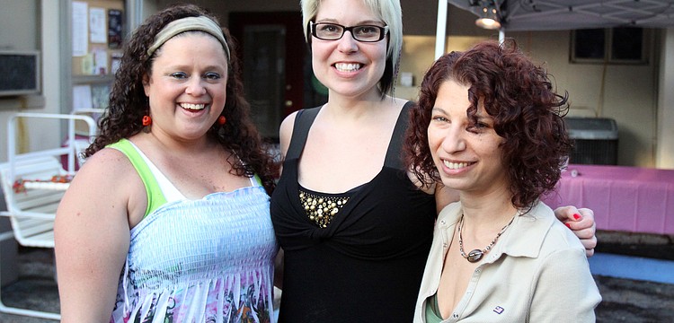 Midgeann Schotsch, Jennifer Sabin and Stephanie Broche, three of the six owners of Five Points Collective, pose together Friday, May 6 during the Wine, Cheese and Beads event at Five Points Collective.