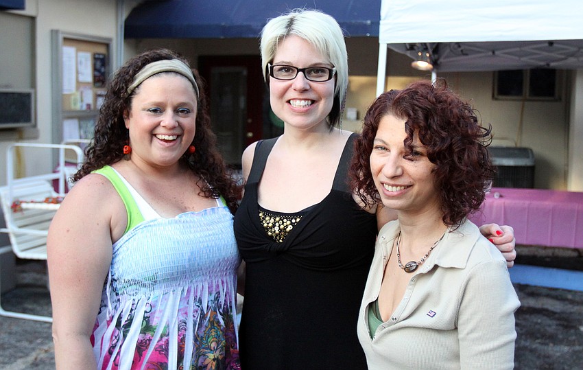 Midgeann Schotsch, Jennifer Sabin and Stephanie Broche, three of the six owners of Five Points Collective, pose together Friday, May 6 during the Wine, Cheese and Beads event at Five Points Collective.