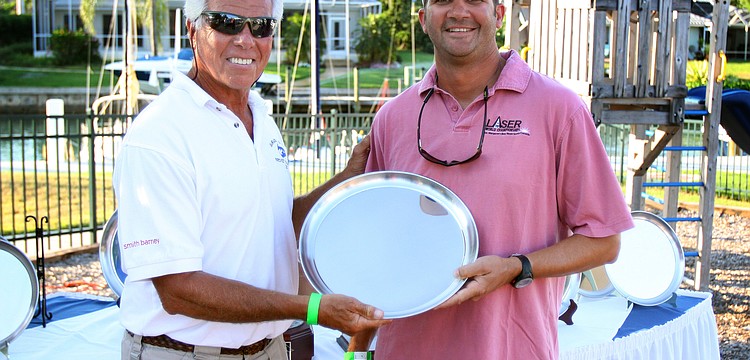 Commodore Bob Baime congratulates Dave Hillmyer for coming in 1st in the spinnaker division Saturday, May 7 in the Sarasota Bay Cup at Bird Key Yacht Club.