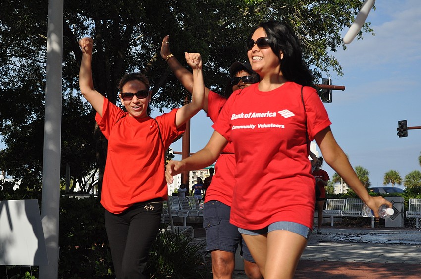 Cristina Chirinos and Zelideh Loredo are excited to walk through the finish line.