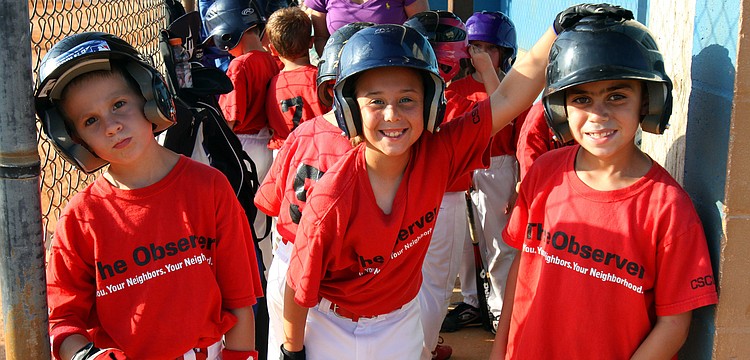 Josh Fields, Macayla Rutherford and Brandon Viera pose in the dugout Monday, May 9 out at Twin Lakes Park.