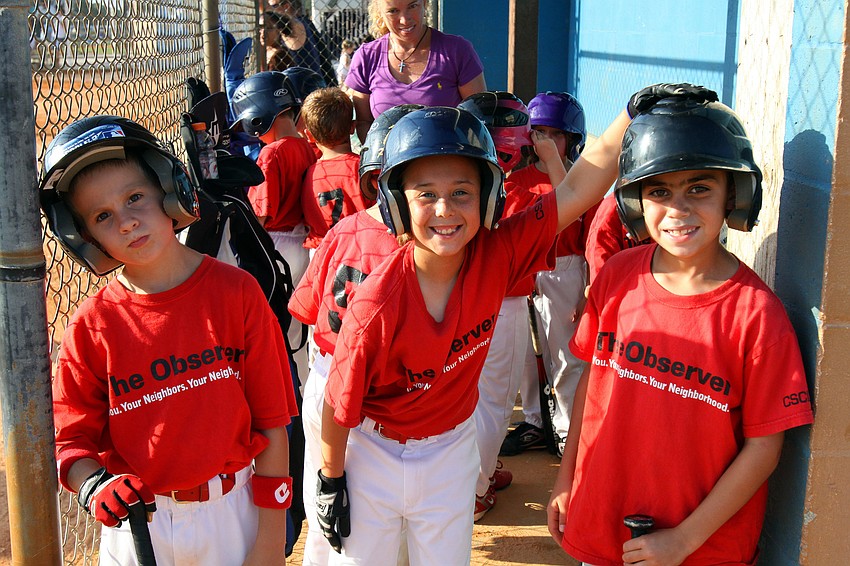 Josh Fields, Macayla Rutherford and Brandon Viera pose in the dugout Monday, May 9 out at Twin Lakes Park.