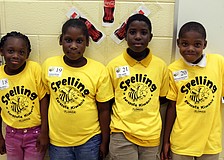 Tyniah Atkins, Latavia Dailey, Tory James and Christian Hannon from Booker Elementary wait for the start of the 3rd grade section of the Sarasota Kiwanis Club's Spelling Bee Friday, May 13 at the Boys and Girls Club.