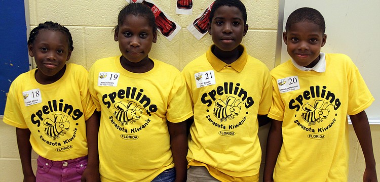 Tyniah Atkins, Latavia Dailey, Tory James and Christian Hannon from Booker Elementary wait for the start of the 3rd grade section of the Sarasota Kiwanis Club's Spelling Bee Friday, May 13 at the Boys and Girls Club.