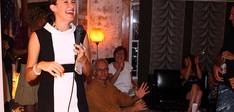 Alexis Orgera laughs and smiles at the warm reception she received from her peers at her book release party Saturday, May 14 at Red Panty Press Studio.