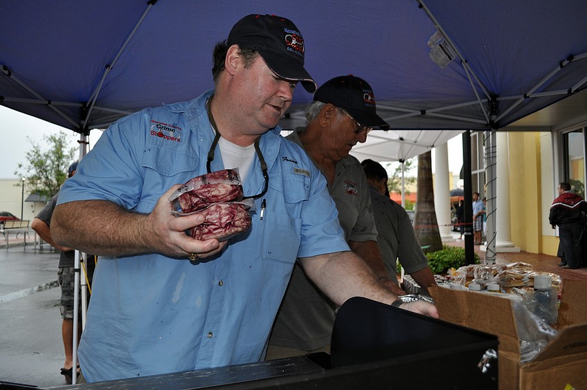 Frank Brunner and Howard McAbee of Crime Stoppers manned the grill.