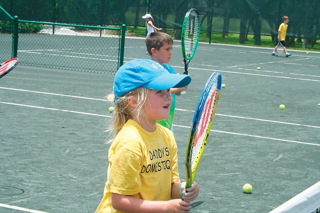 Camille Johnson gets ready to hit the ball at the Longboat Key Club and Resort's Summer Sports Camp and Junior Tennis Camp last summer.