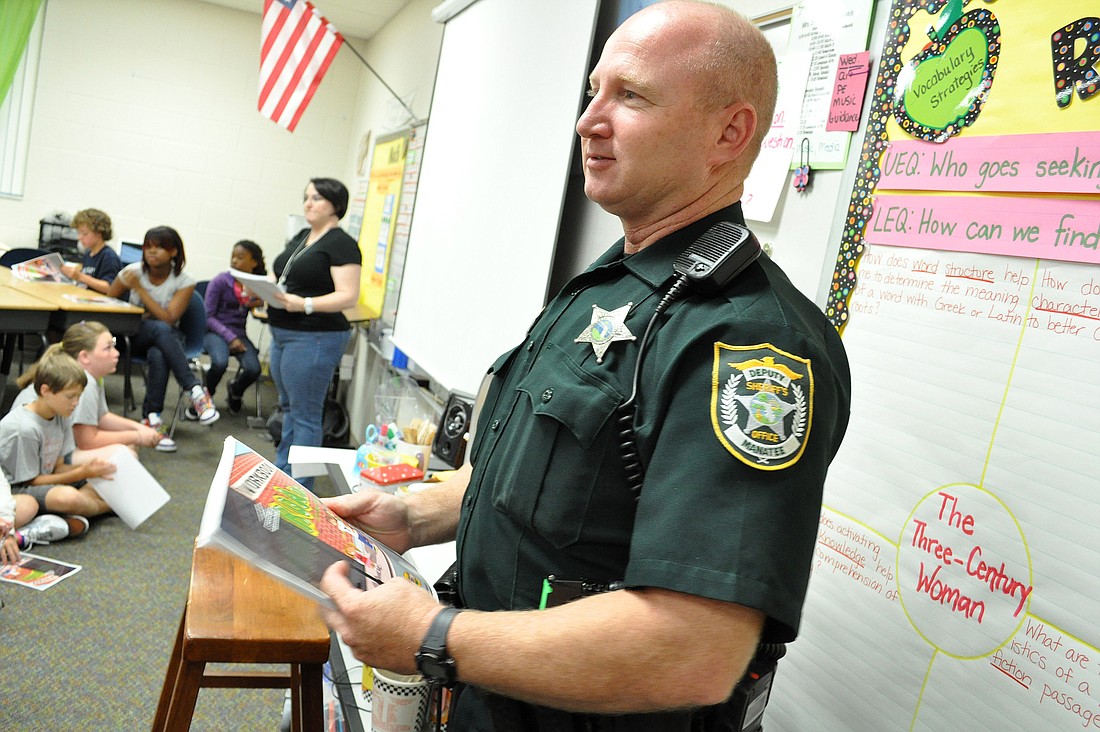 Manatee County Sheriff's Office Dep. Russ Younger teaches a group of fifth-grade students at Gullett Elementary School about making good choices, which is part of the sheriff's office's Crossroads program.