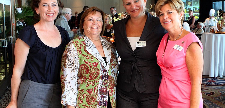 Cemantha Crain, Jane Vermeulen, Malaka Hilton and Kathy Leavesley pose together Tuesday, May 17 during the "An Inspired Journey" evening at the Sarasota Yacht Club.