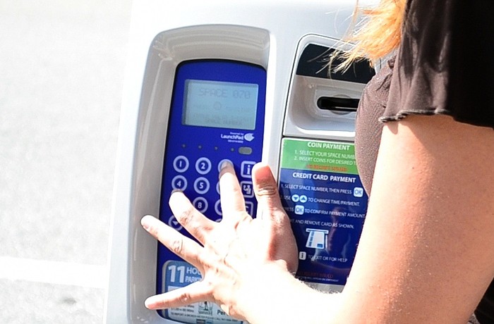 Downtown parking meters will accept payment with coins and credit/debit cards. However, dollar bills cannot be used.