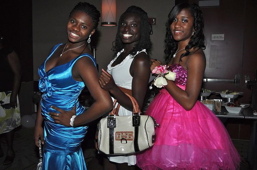 Ebony Bass, Alexis Lee and Jaberia Jones show off their dresses at Booker High School's prom.