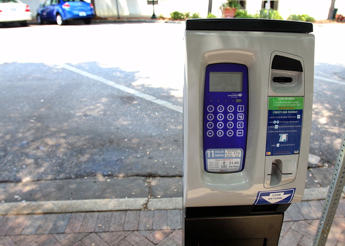 The new parking meters are electronic and take coins and debit/credit cards only.