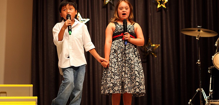 Jackson, 2nd grade, and Cassidy, 1st grade, Geach sing "The Climb" together Wednesday, May 25 during "An Evening With the Stars" Talent Show 2011 at Phillippi Shores Elementary.