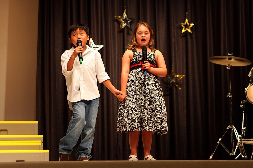 Jackson, 2nd grade, and Cassidy, 1st grade, Geach sing 