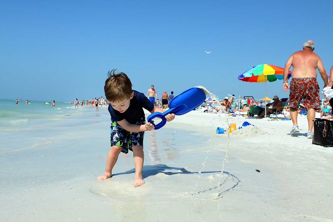 Brenden Beith, 4, digs Siesta Beach. He had fun in the sand over Presidents Day weekend this year.