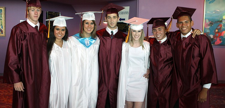 Stephen Hueston, Alyssa Nutter, Lauren Kennedy, Andrew Interial, Taylor Keenan, Jason Rosales and Jereme Johnston pose together while they wait down stairs prior to graduating Friday, May 27 at the Van Wezel.