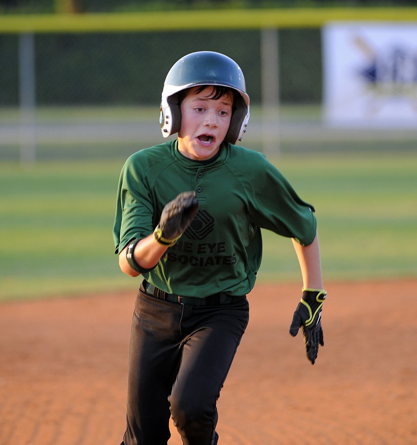 Eleven-year-old Connor Knapp rounds third and heads for home during the Eye Associatesâ€™ game versus G&S Lawn May 25.