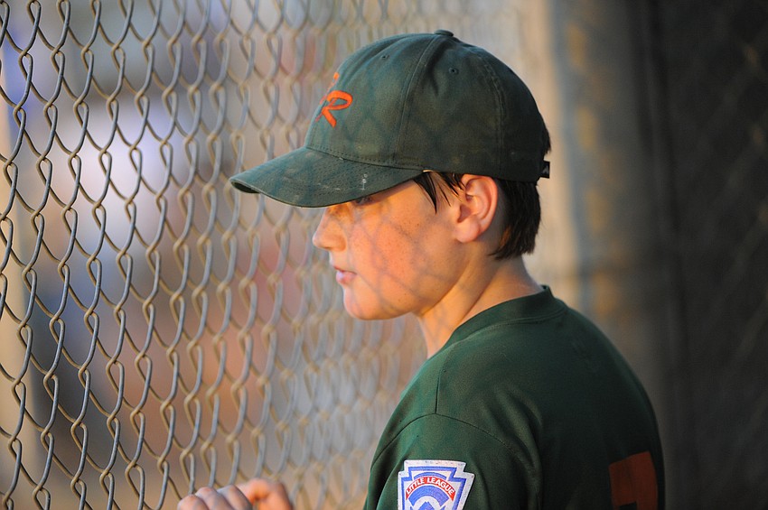 First baseman Grady Martin watches his G&S Lawn teammates try and regain the lead.