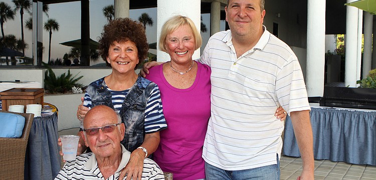 Barbara Pressman, Bob Berns, Bonnie Zeamon and Douglas Pressman pose together at the Longboat Key Club's BBQ and Movie night Saturday, May 28 at the Longboat Key Club hotel poolside.