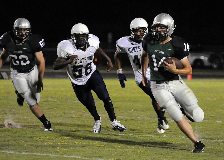 Sophomore quarterback Zach Reda runs up the sideline during the Mustangs Spring Game May 27.