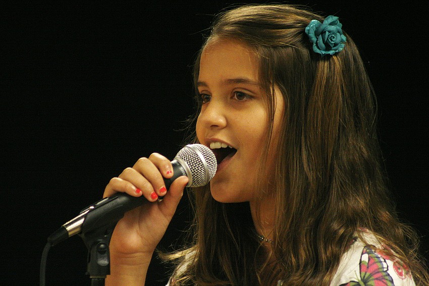 Emily Roman and two other Braden River singers sang the national anthem before the ceremony.