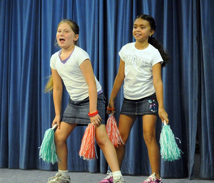 Second-grader cheerleaders Aly Wilson and Lizbeth Nunez performed a spirited routine.