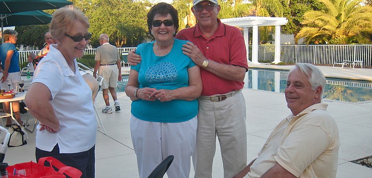 Carolyn and Joe Guyton, center, caught up with friends Kay (left) and Ron (right) Houston.