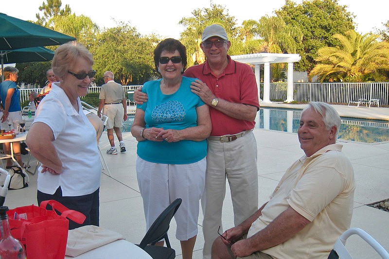 Carolyn and Joe Guyton, center, caught up with friends Kay (left) and Ron (right) Houston.